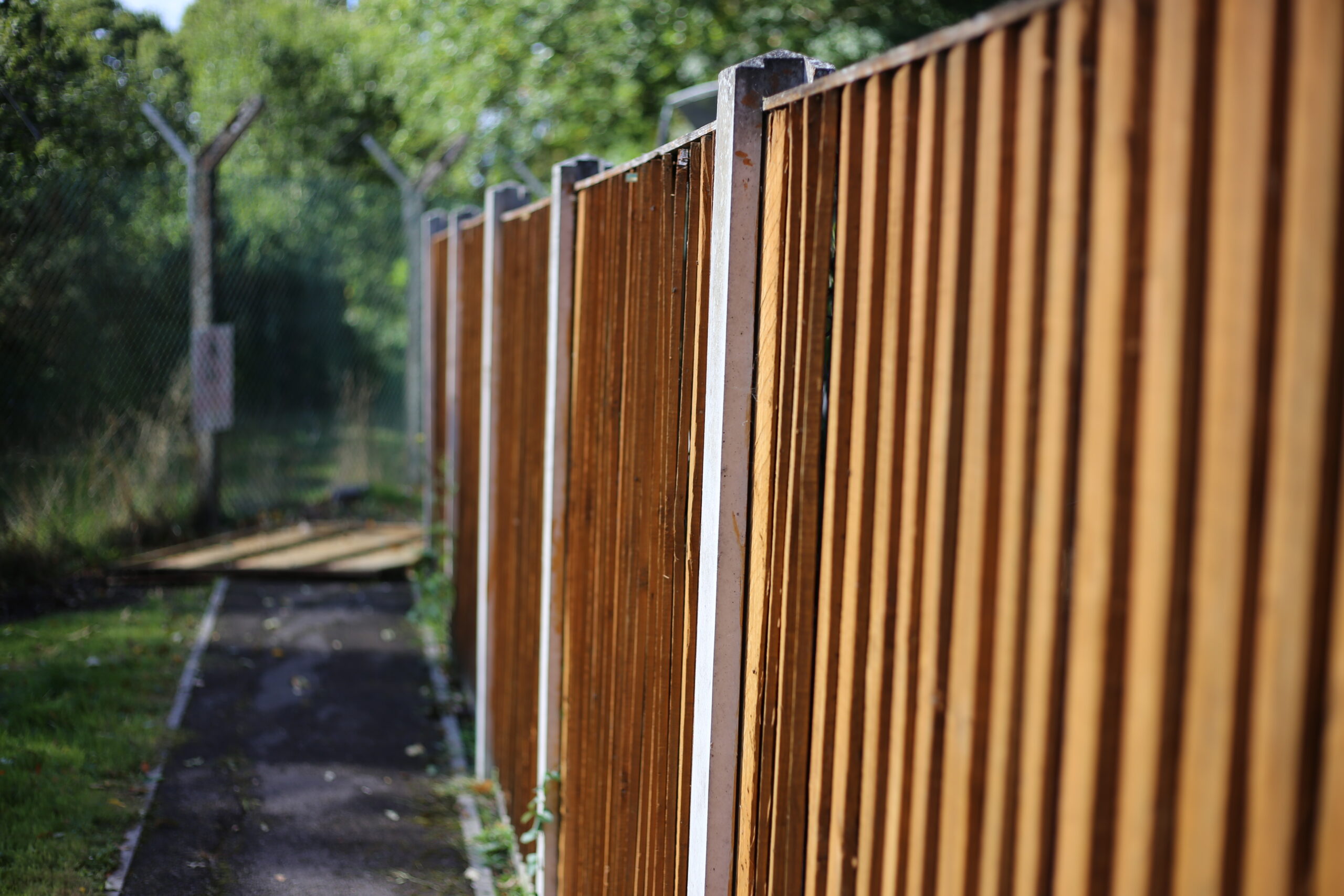 Close-board timber fence panels with concrete posts