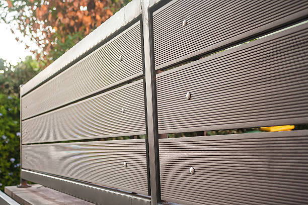 Composite fence panels in a slate grey finish