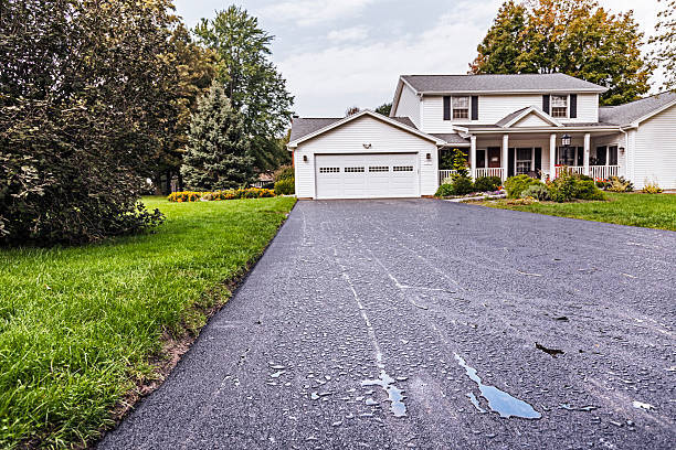 A finished driveway providing off-street parking at a Boston property